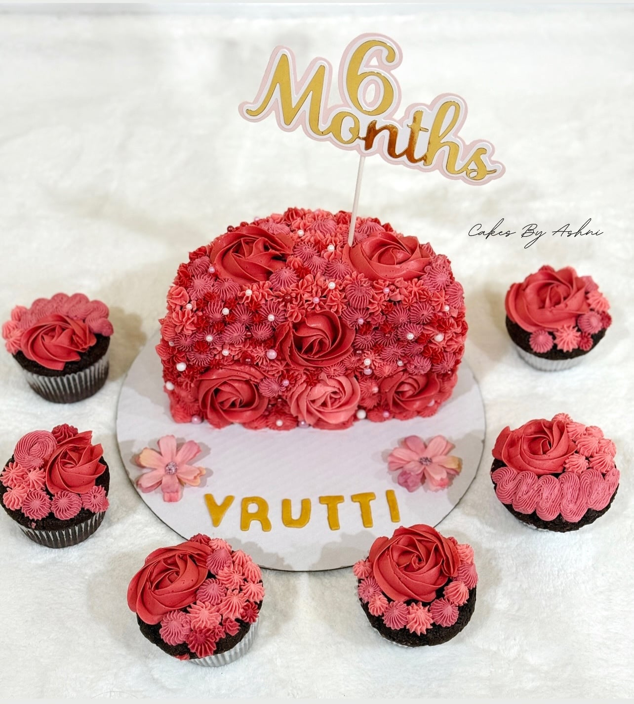 Adorable custom 6-month milestone birthday cake for baby Vrutti, made by Cakes by Ashni in NJ