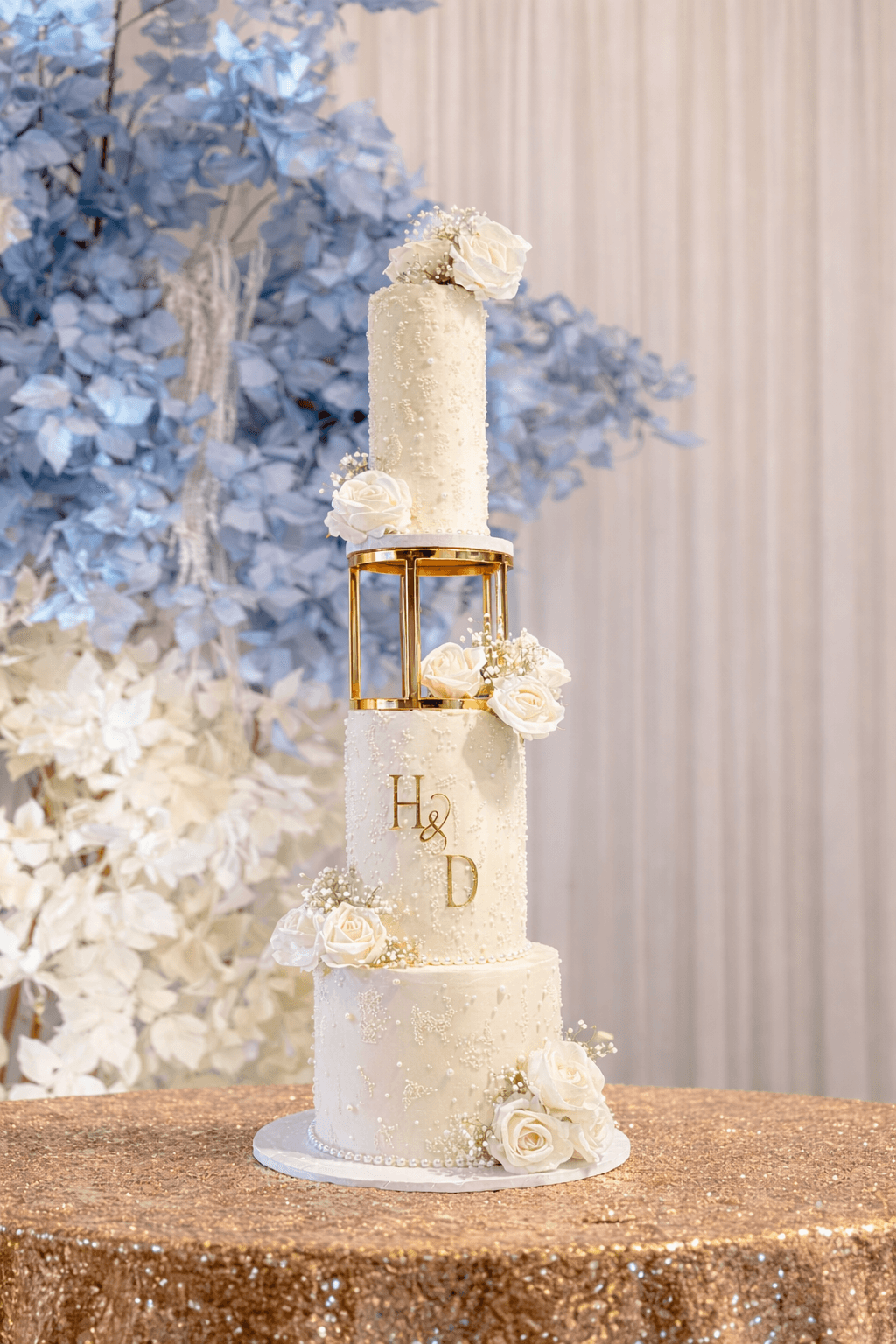 Elegant three-tier eggless wedding cake with soft floral details, handcrafted by Cakes by Ashni in New Jersey